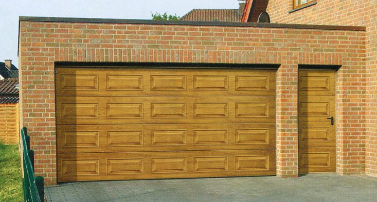 Georgian insulated sectional garage door in Golden Oak laminate finish